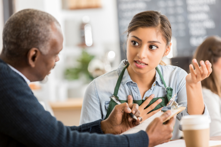 Employee and manager discussing performance evaluation