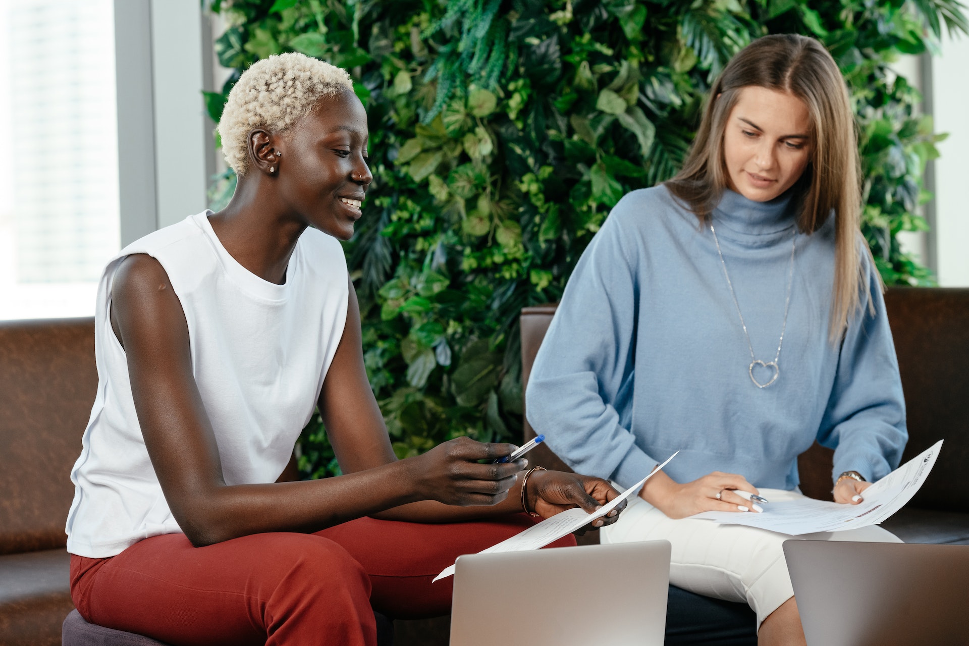 Two diverse woman colleagues during mentorship program