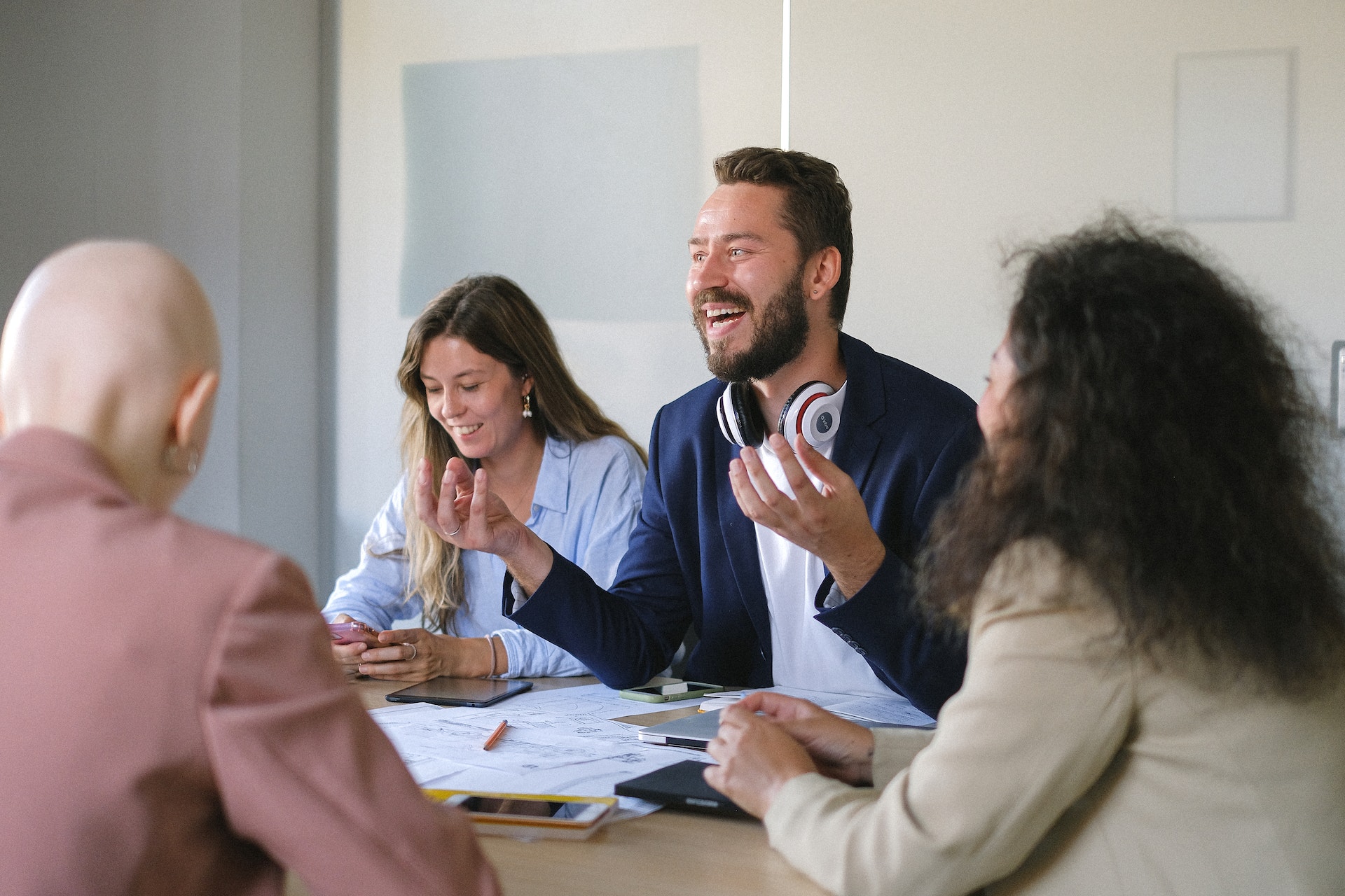 Cheerful chief happiness officer leading meeting