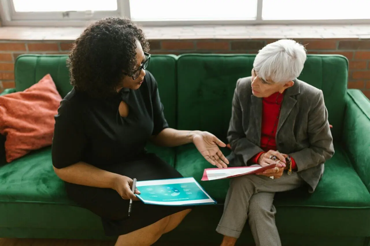 two women colleagues discussing strategies to combat a toxic workplace